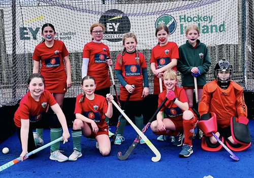 minis and juniors hockey team with happy players