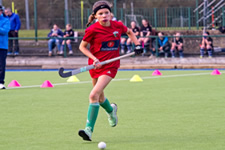 junior hockey player running with the ball