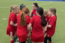 mini hockey players in a huddle